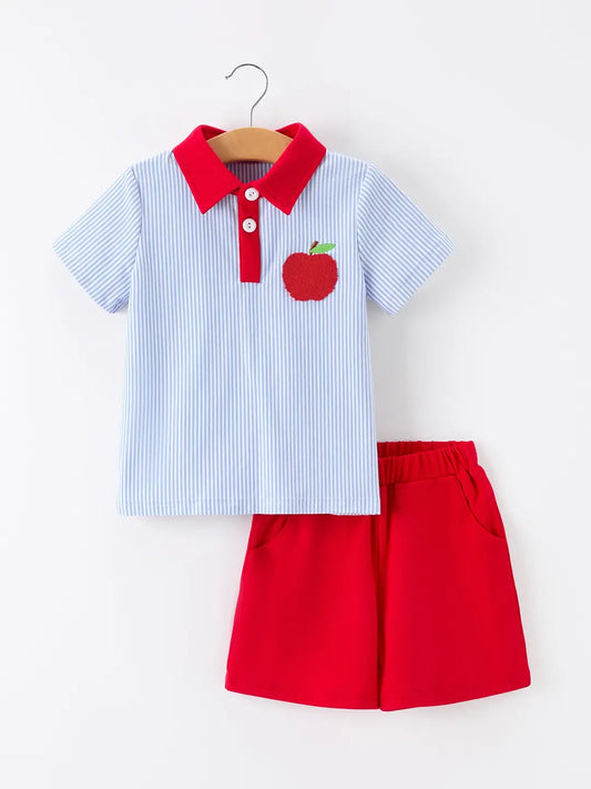 Children's outfit with a striped polo and red shorts on a white background