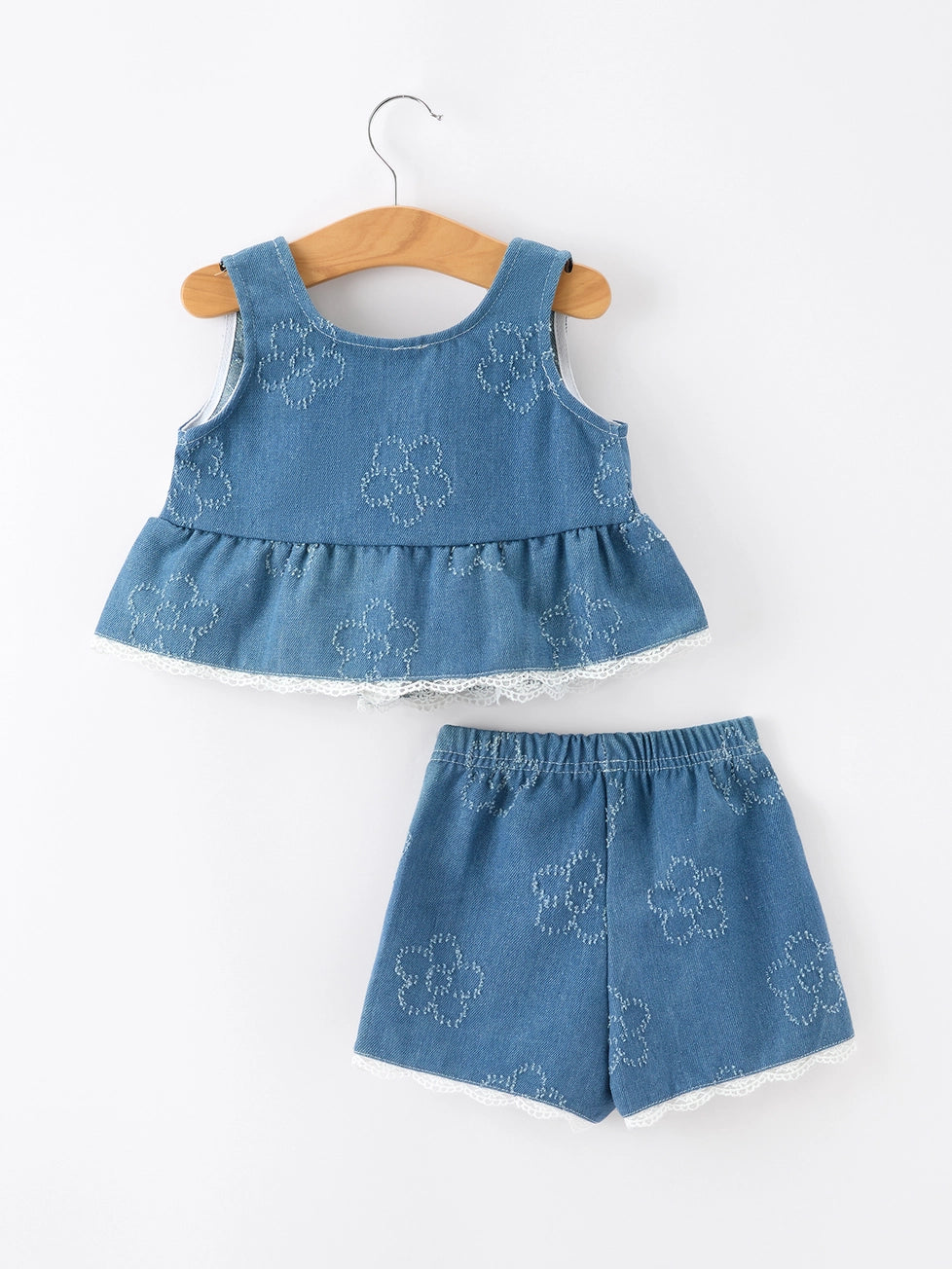 Children's denim outfit with top and shorts on a white background